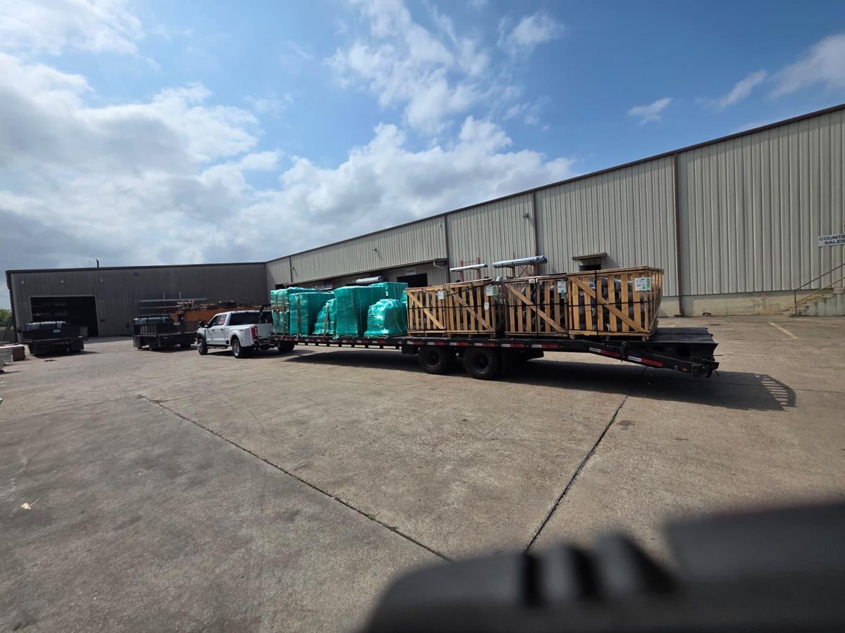 Gooseneck trailer hauling wooden crates